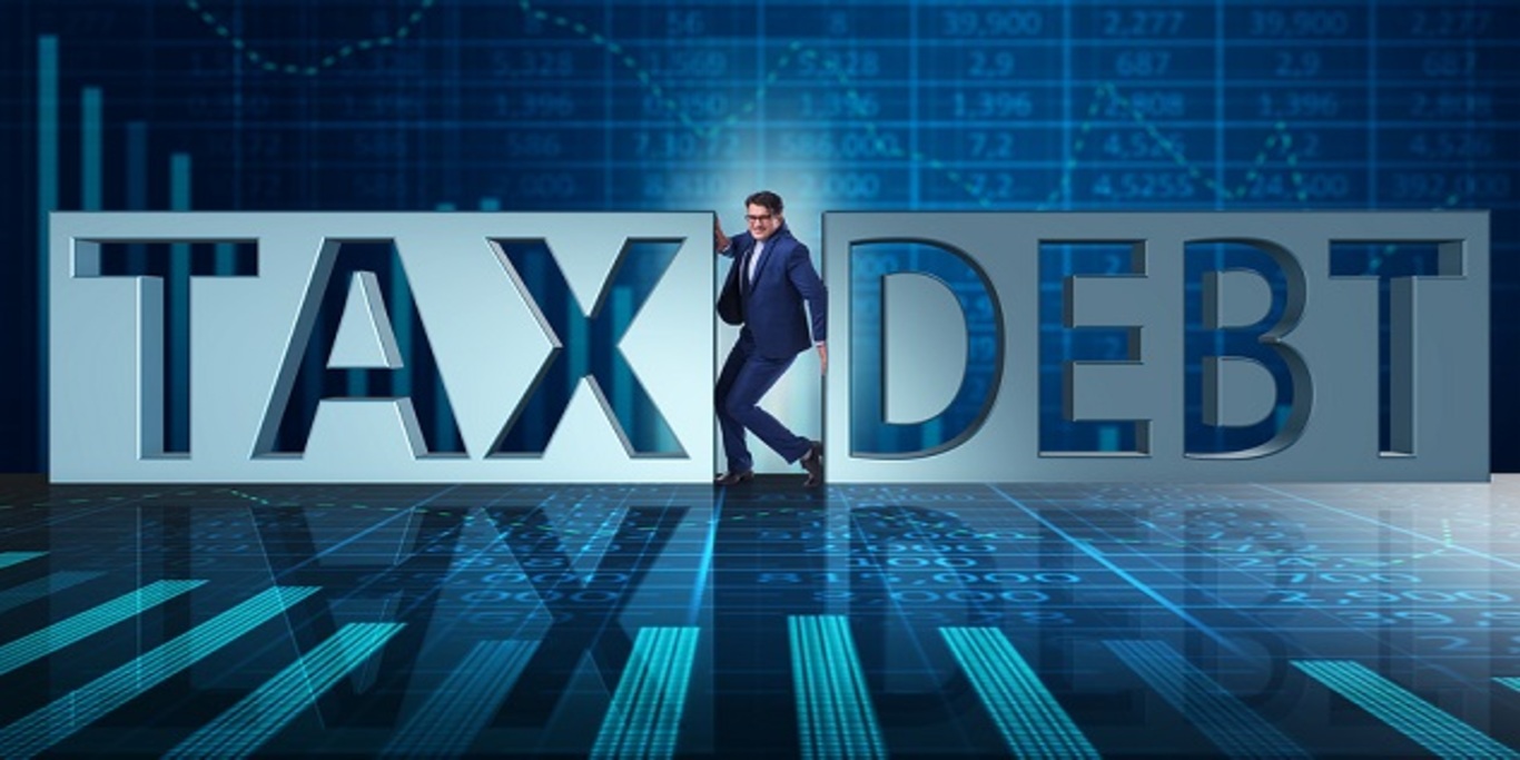 Businessman in tax and debt concept how to get rid of tax debt